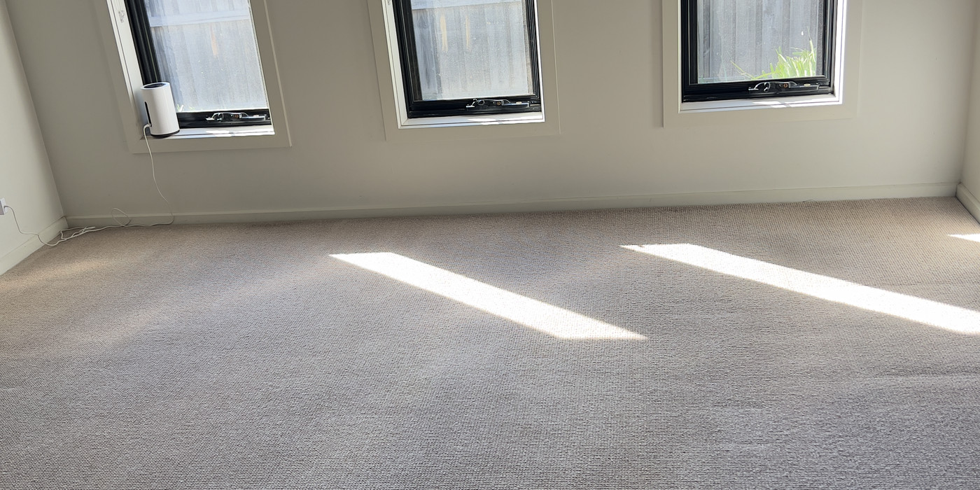 Empty lounge room photographed after the final clean, ready for handover